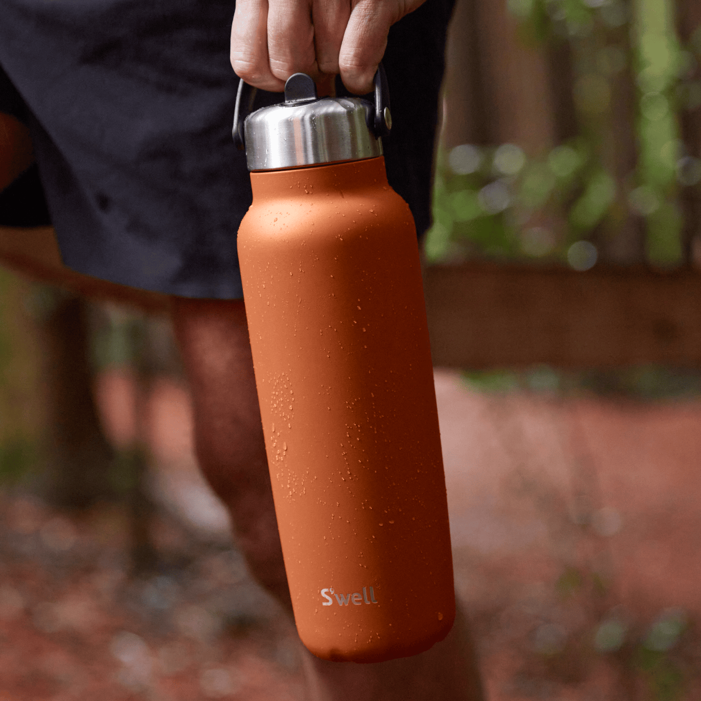 explorer-with-flip-straw-lid-40oz-l1 Swell-Explorer-Water-Bottle-40oz-Orange-Carnelian-LifeStyle.png